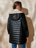 Women's black quilted longline puffer coat with relaxed silhouette