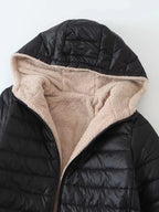 Women's black quilted longline puffer coat with relaxed silhouette