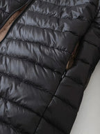 Women's black quilted longline puffer coat with relaxed silhouette