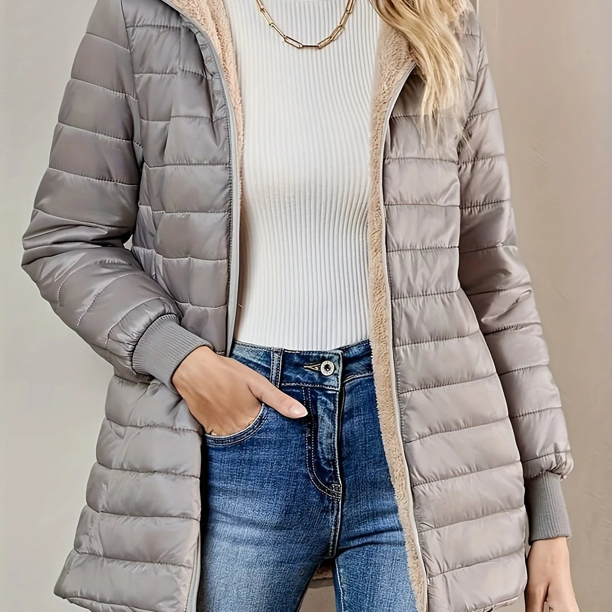Women's light grey quilted longline puffer coat with relaxed silhouette