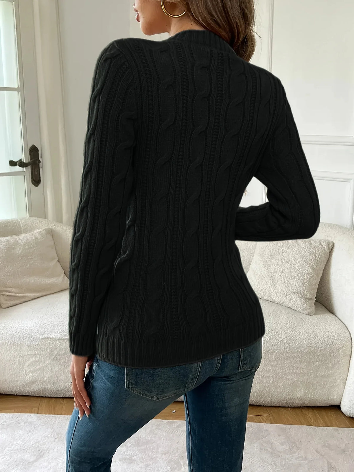 Women's black classic twist-knit sweater, with a ribbed hem