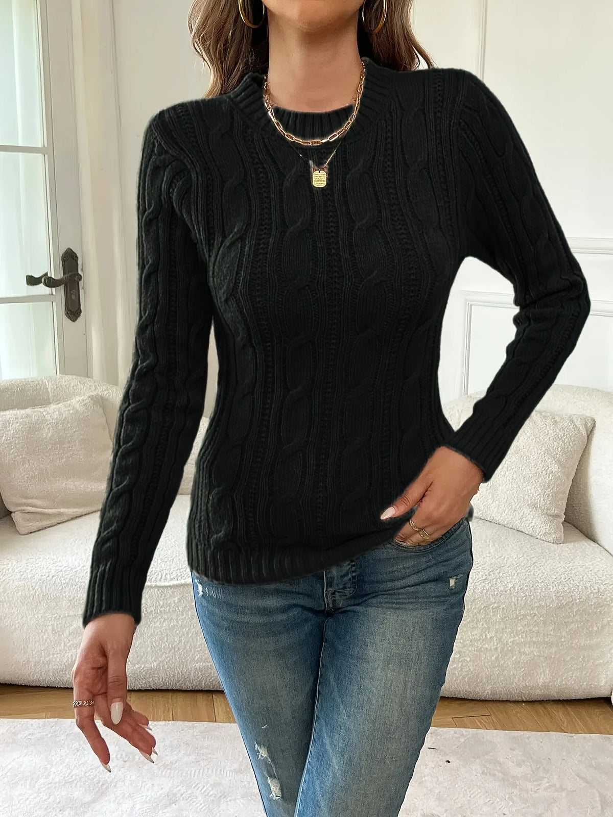 Women's black classic twist-knit sweater, with a ribbed hem