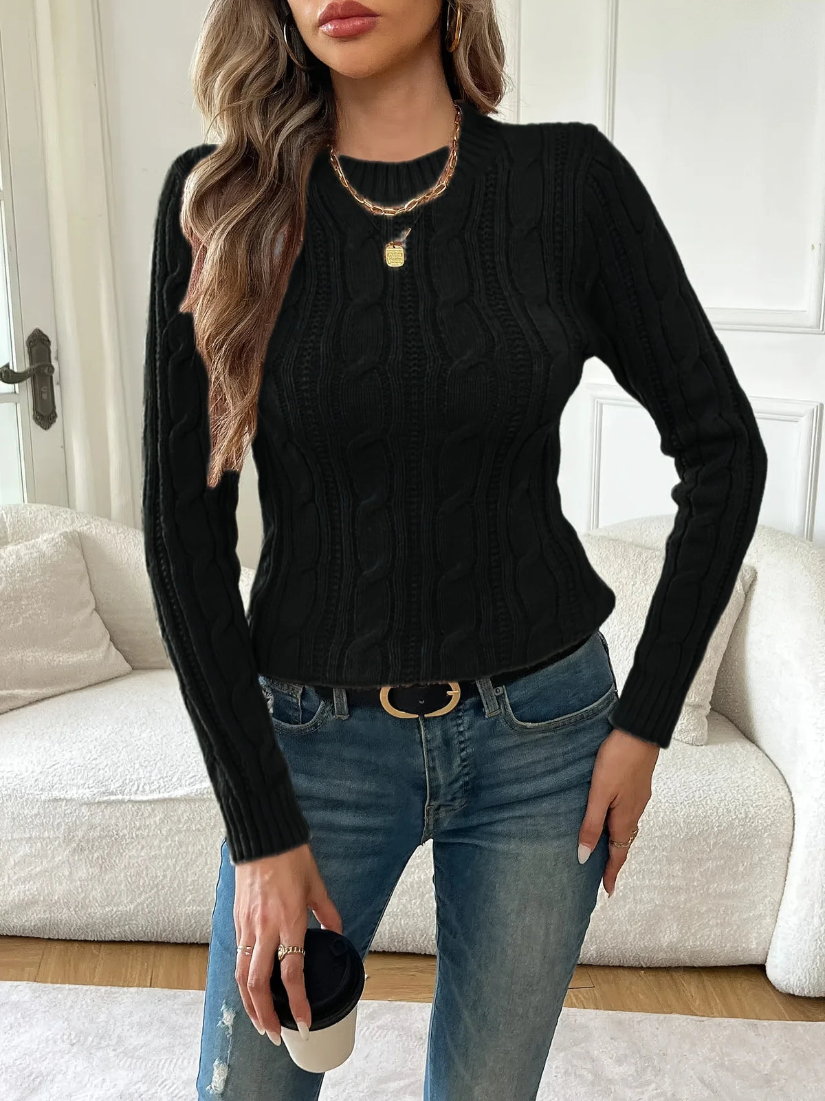 Women's black classic twist-knit sweater, with a ribbed hem