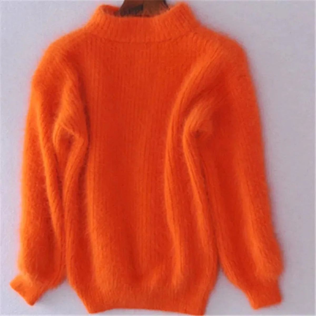 Women's orange soft ribbed mock-neck sweater for chilly days