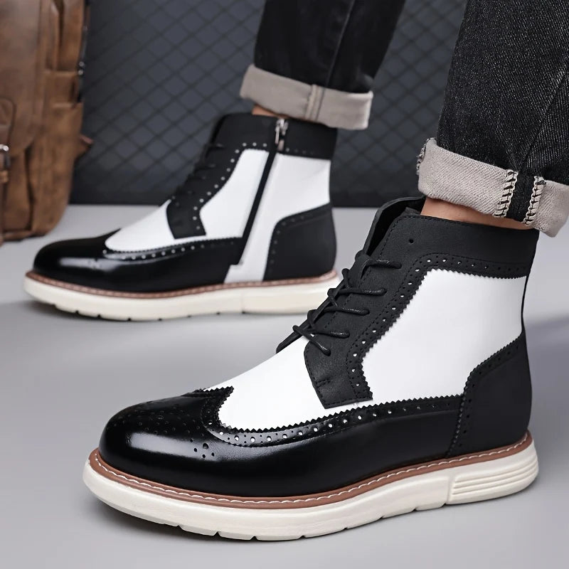 Men's black wingtip ankle boots styled with rolled denim