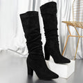 Women's black slouch knee-high heeled boots with pull-on fit