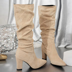 Women's black slouch knee-high heeled boots with pull-on fit
