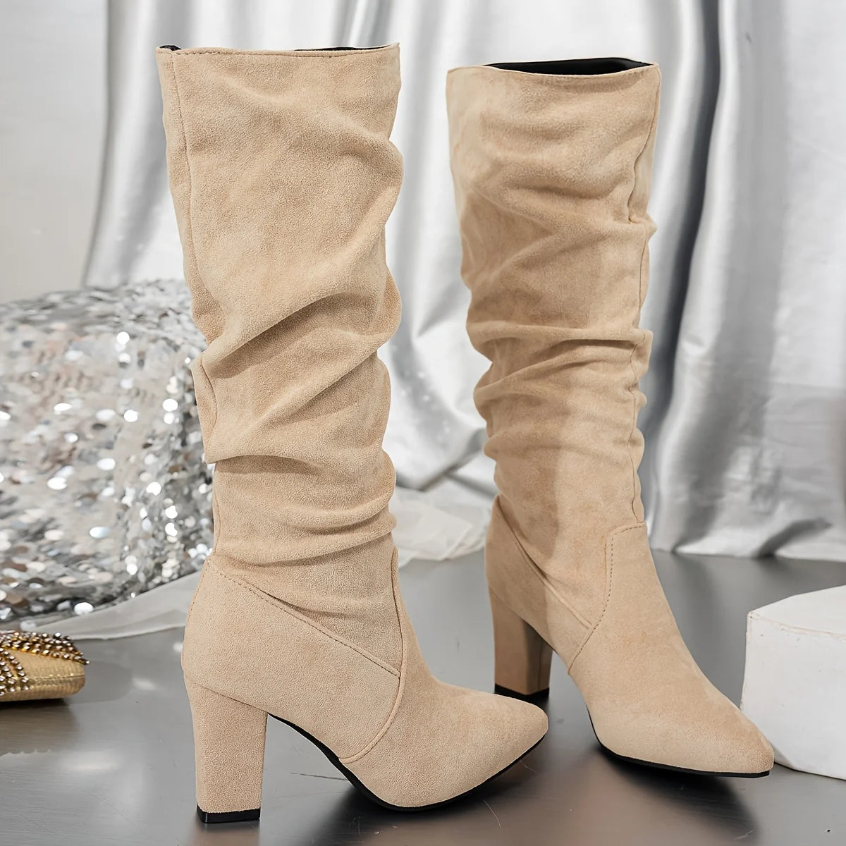 Women's black slouch knee-high heeled boots with pull-on fit