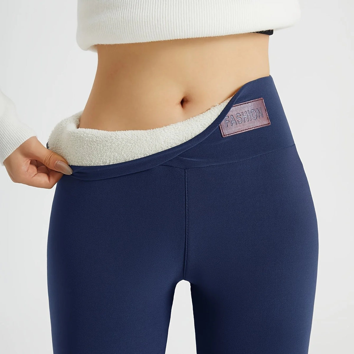 Women's navy blue high-waist fleece-lined skinny leggings for winter, waistband detail