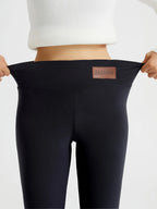 Women's black high-waist fleece-lined skinny leggings for winter