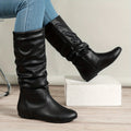 Women's black slouched mid-calf boots with relaxed pull-on fit