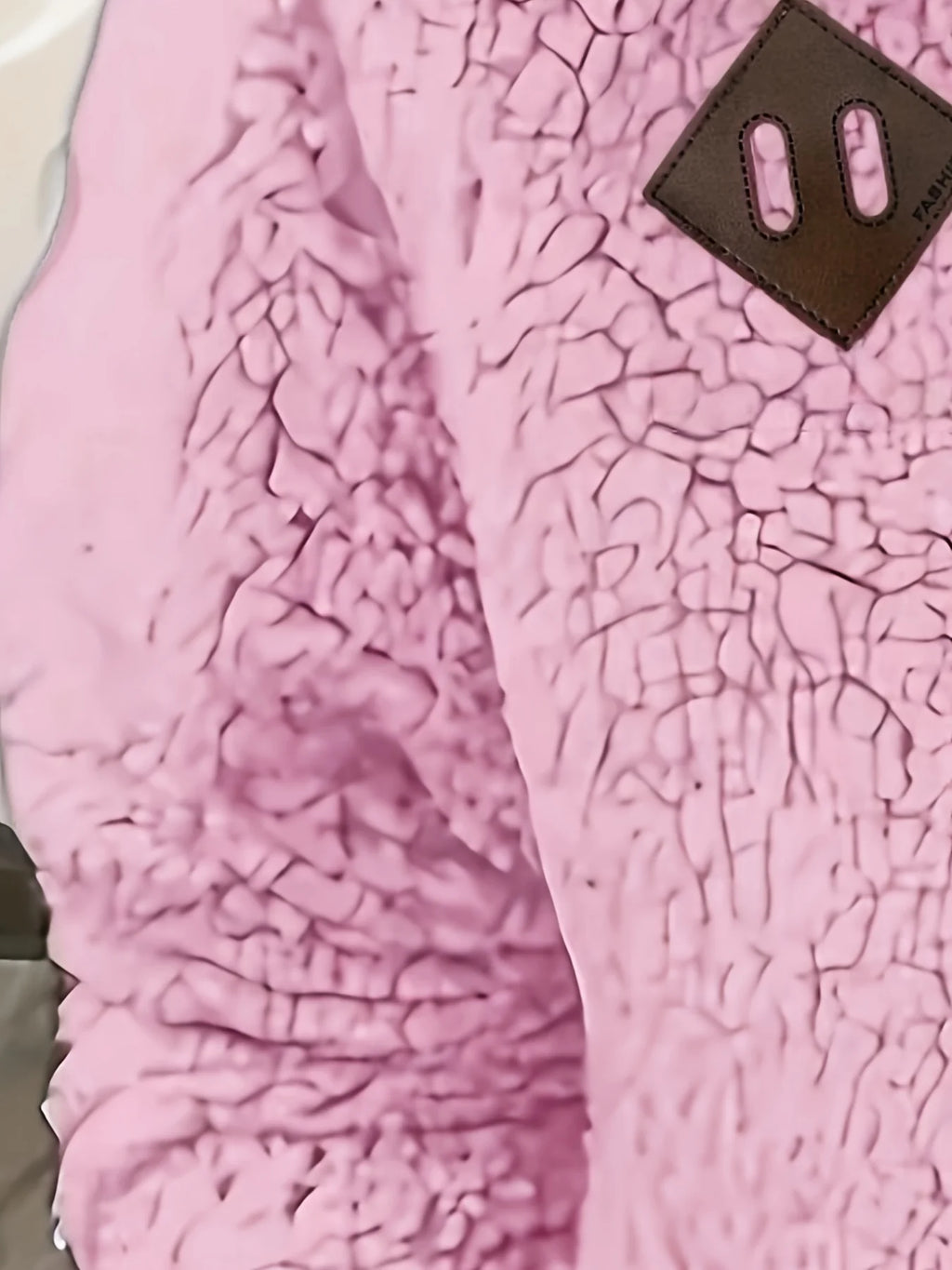 Women's pink sherpa half-zip pullover fabric detail