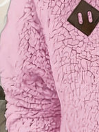 Women's pink sherpa half-zip pullover fabric detail
