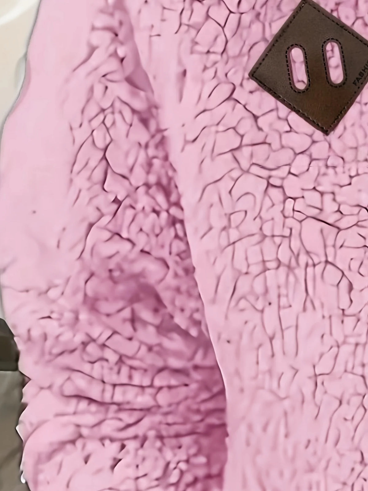 Women's pink sherpa half-zip pullover fabric detail