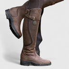 Women's dark brown supportive buckled ankle boots, with an adjustable strap