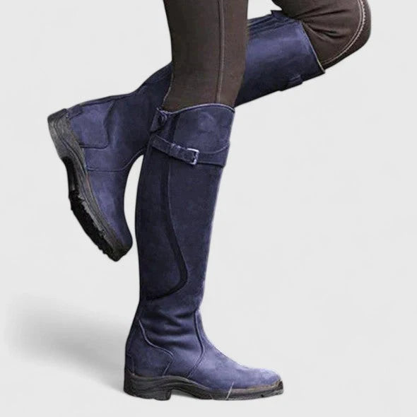Women's blue supportive buckled ankle boots, with an adjustable strap