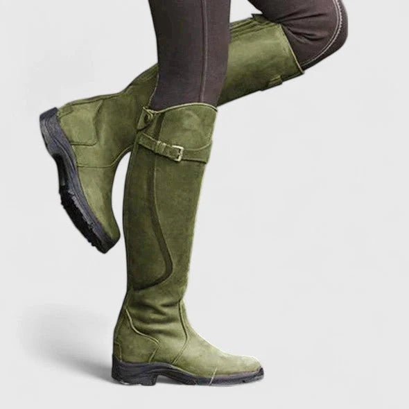 Women's green supportive buckled ankle boots, with an adjustable strap