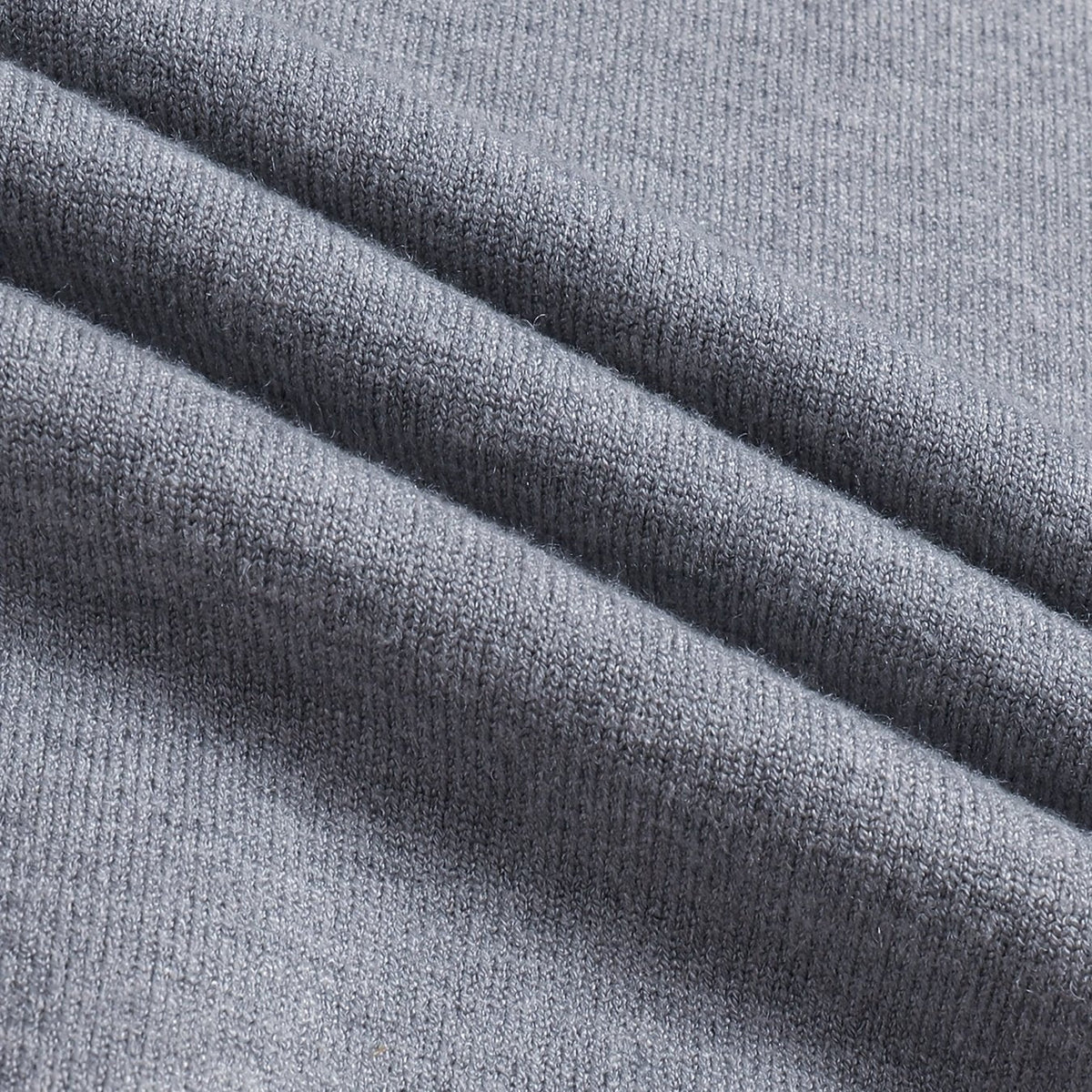 Men's gray ribbed knit fabric close-up, mock-neck sweater