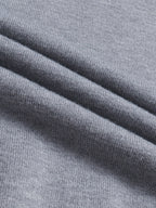 Men's flecked gray ribbed knit fabric close-up, mock-neck sweater