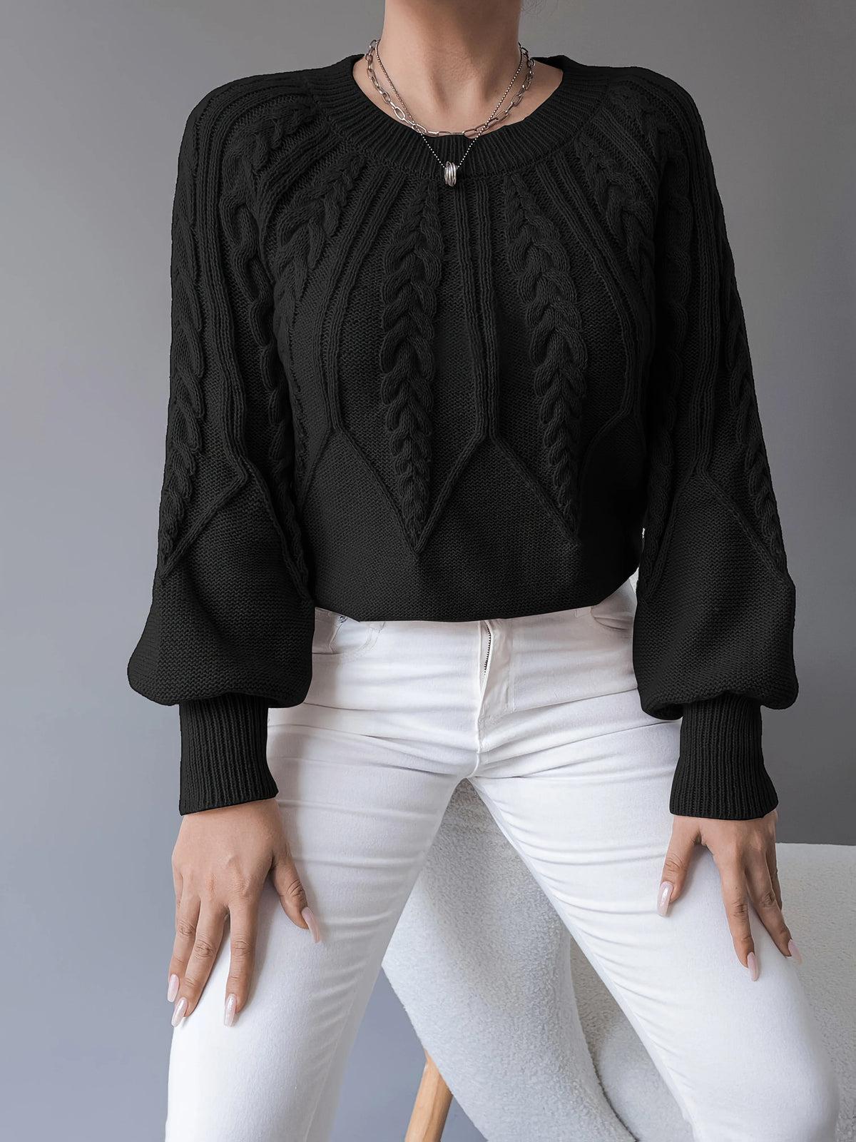 Women's black cable knit lantern sleeve sweater