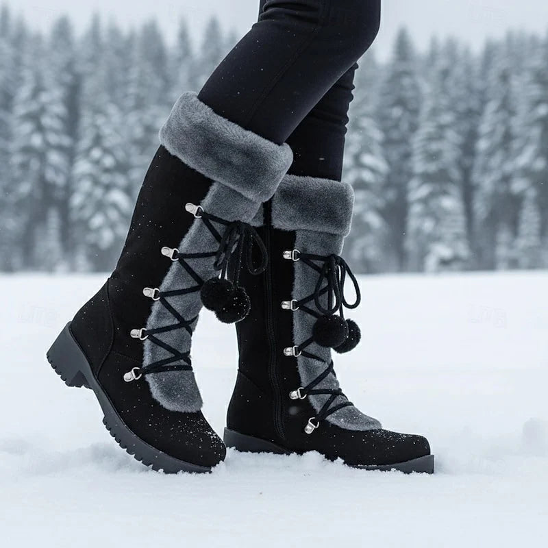 Women's black cozy lace-up winter boots, with eyelet lacing