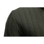Men's army green half-zip sweater, close-up of ribbed shoulder