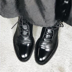 Women's black classic lace-up ankle boots, with eyelet lacing