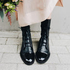 Women's black classic lace-up ankle boots, with eyelet lacing