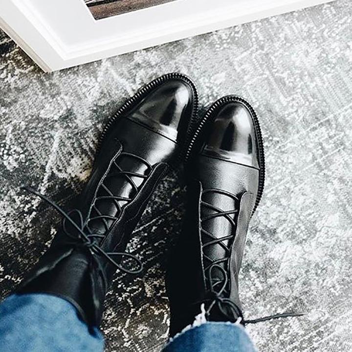 Women's black classic lace-up ankle boots, with eyelet lacing