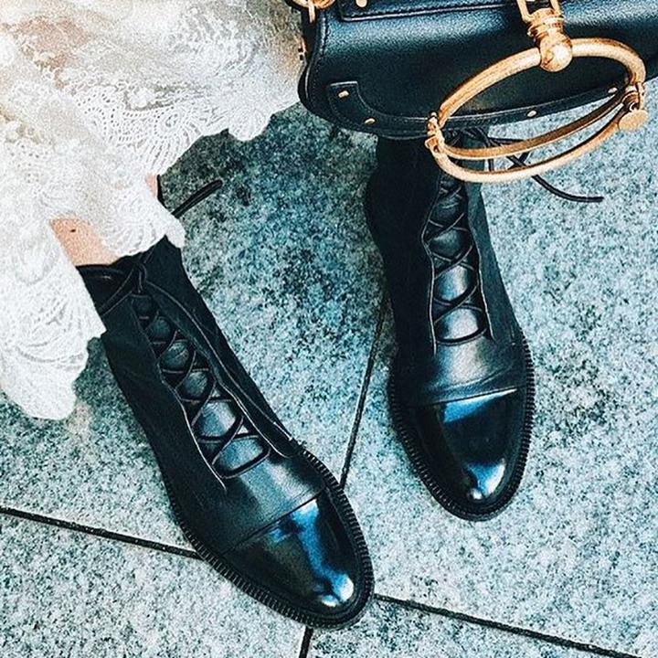 Women's black classic lace-up ankle boots, with eyelet lacing