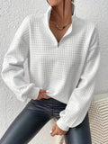 Women's white relaxed-fit quarter-zip sweater with ribbed hem
