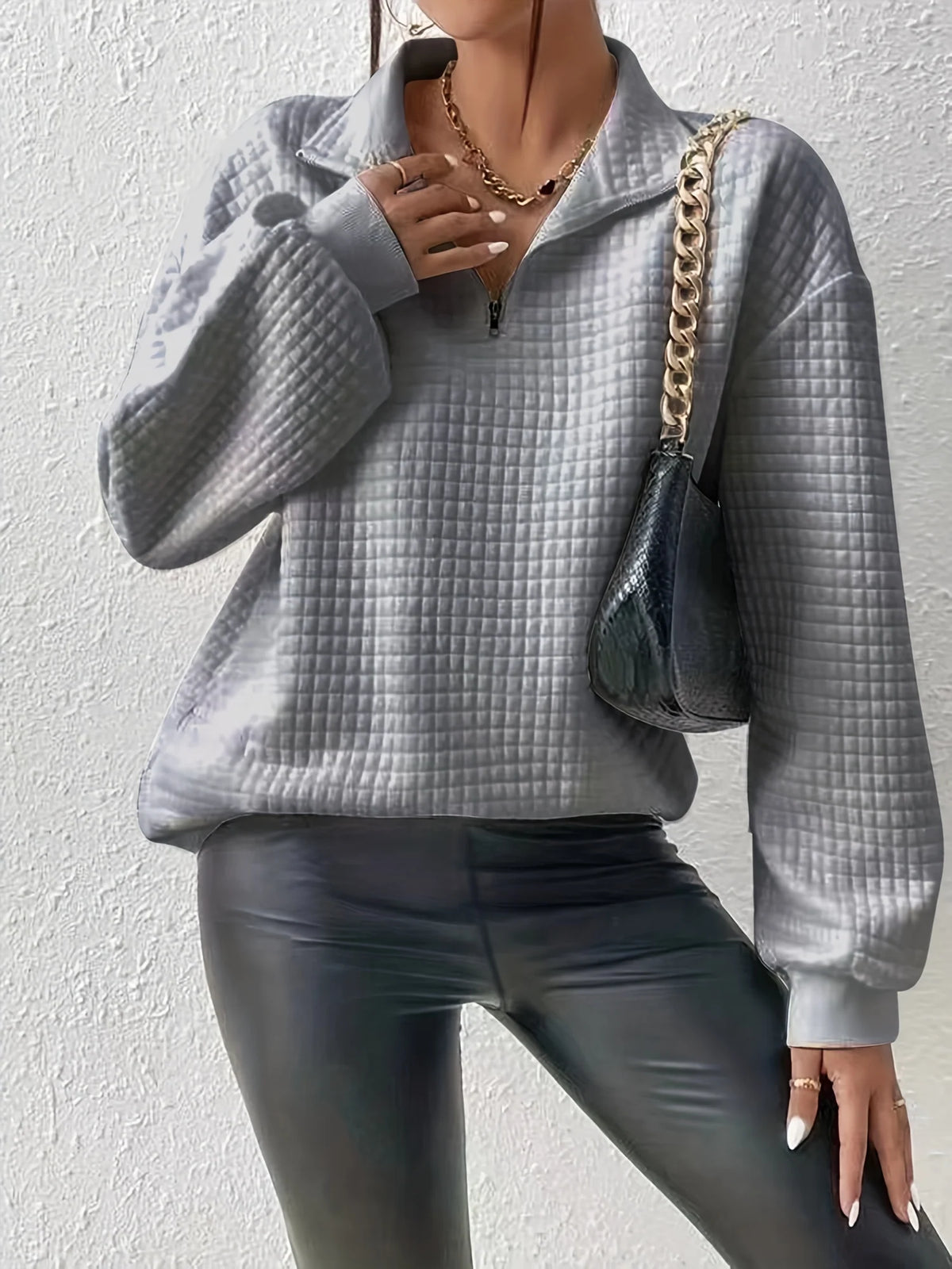 Women's grey relaxed-fit quarter-zip sweater with ribbed hem