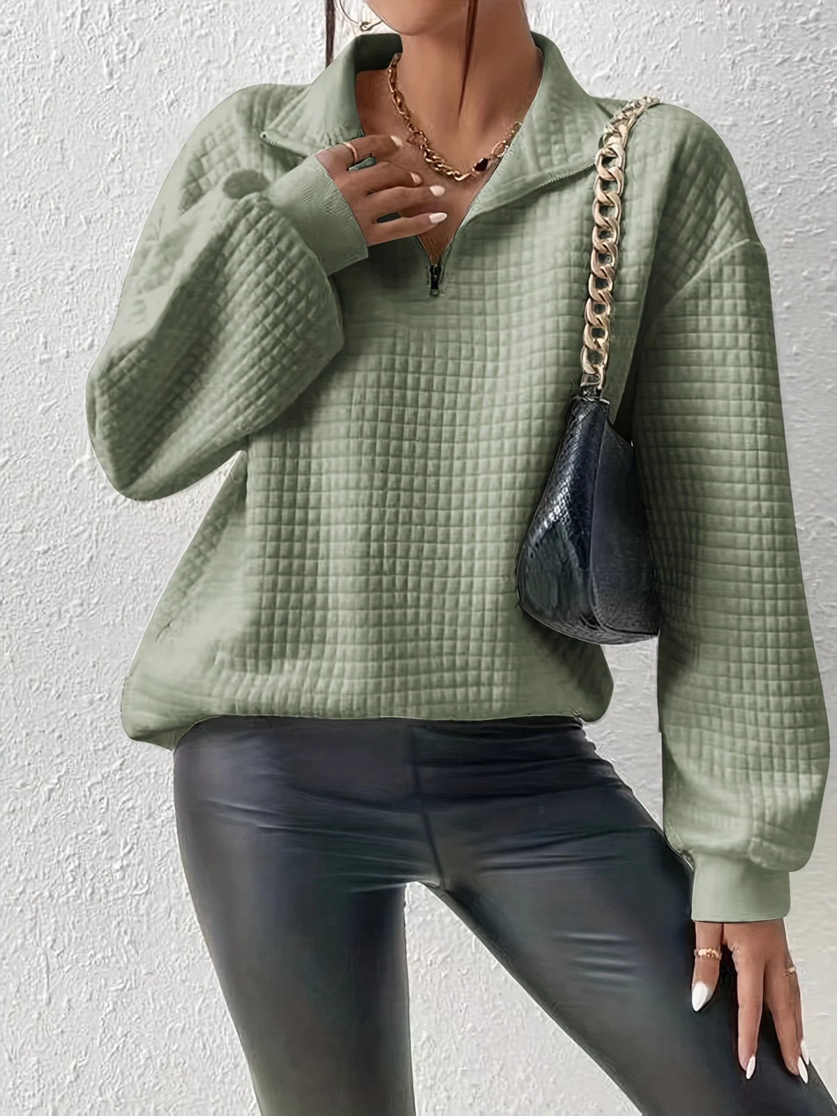 Women's matcha color relaxed-fit quarter-zip sweater with ribbed hem