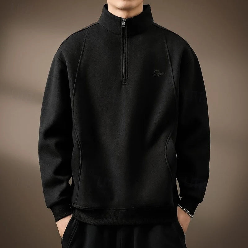 Men's black quarter-zip pullover, mock neck detail