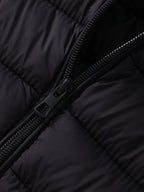 Women's black cropped puffer jacket zipper detail